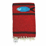 Red woven blanket with a blue fish design on a white background