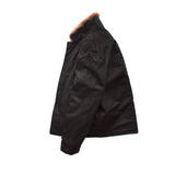 Side view of a black canvas coat on a flat white background