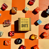 Mystery dice box surrounded by colorful dice on a checkered background