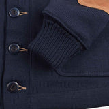 Navy blue textured sweater with buttons and brown leather patch