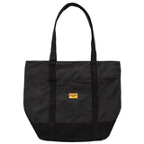 Black tote bag with a yellow label on a white background