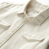 close up flat lay of the outerknown blanket shirt in white ecru with white buttons