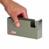 Hand picking up tape dispenser to show size scale