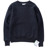 Navy blue sweatshirt with a brand tag on a light gray background