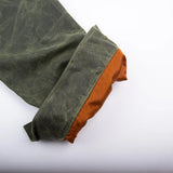 "rolled up sleeve exposing satin lining of the waxed canvas riders jacker "