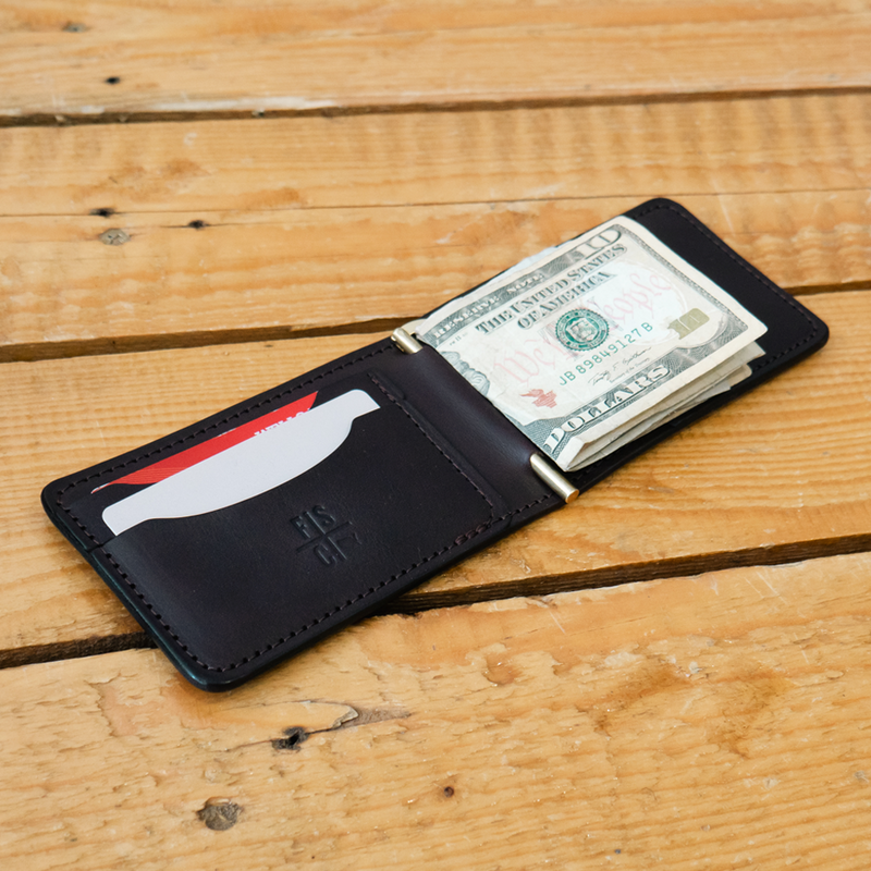 Cash clip wallet with cash and cards inside