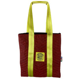 Red tote bag with yellow straps on a white background. 