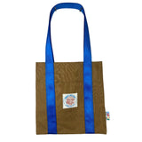 Brown tote bag with blue traps on white background
