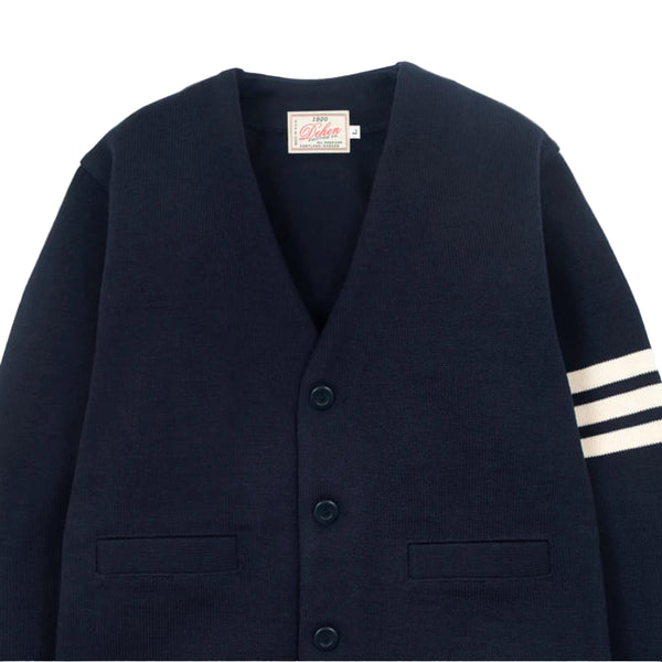 Navy blazer with a brand label on a light gray background