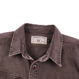 View of the collar of a brown utility shirt, the tag reads “Freenote Cloth”