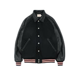 Black varsity jacket with leather sleeves on a white background