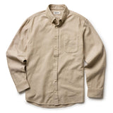 Beige button-up shirt on a white background