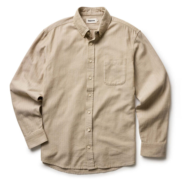 Beige button-up shirt on a white background