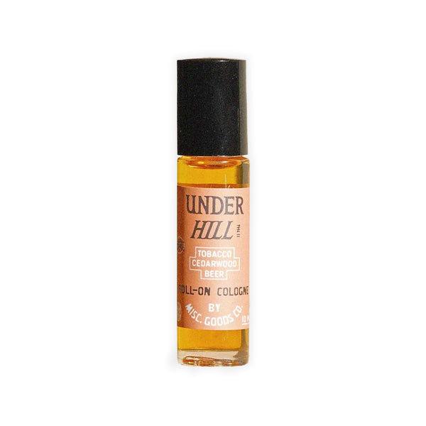 Roll-on cologne bottle by Under Hill on a white background