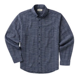 Front of long-sleeved button up shirt in blue grid-patterned fabric. 