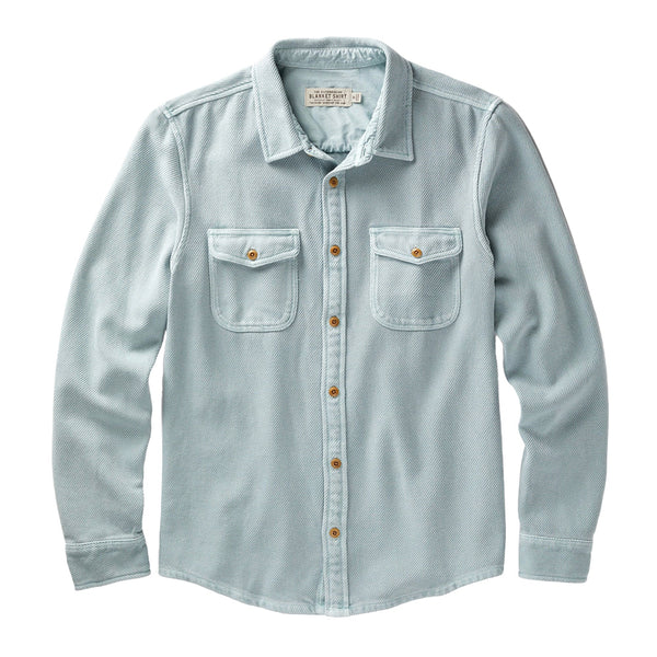 flat lay sky blue harbor outerknown chroma blanket shirt with brown buttons