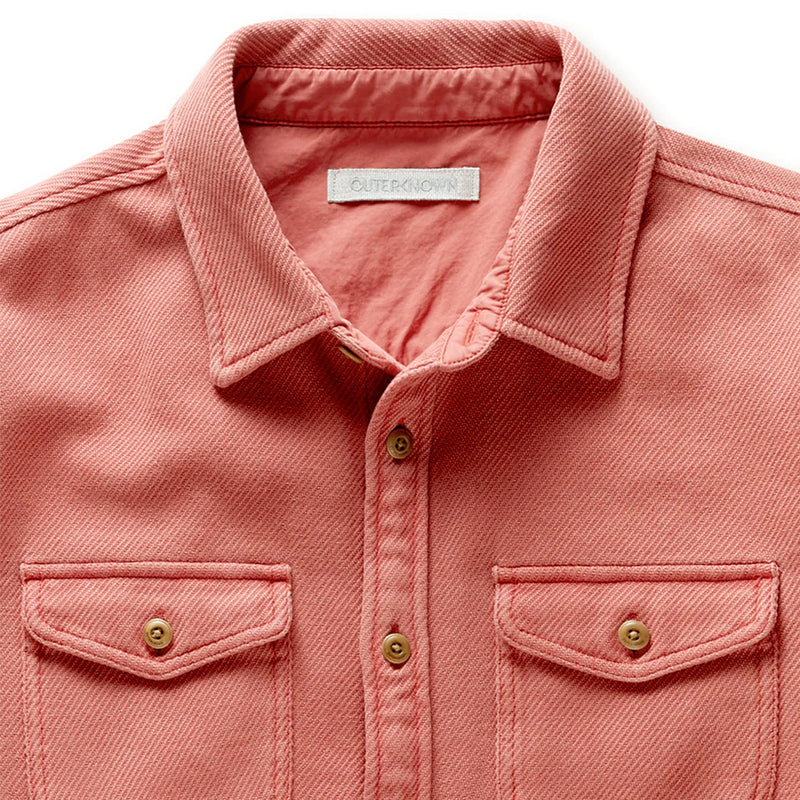 close up of the collar and tan buttons of the salmon colored mineral red outerknown chroma blanket shirt