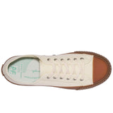 Top-down view of off-white canvas sneaker with gum sidewalls and round toe cap, white laces, and silver grommets. 