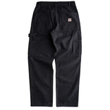 Back of a pair of relaxed fit black canvas utility pants with a hammer loop on the left side and two patch back pockets. On the right pocket is a small white fabric patch with the Iron and Resin logo embroidered in red. 