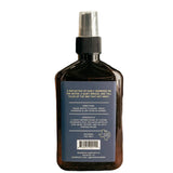 Back of bottle with text [Directions: Shake bottle to blend. Spray overhead in any room as needed. Ingredients: A highly refined blend of custom fragrance oils. Including notes of dark musk, vetiver, and fig with purified water. External use only.]