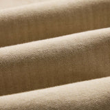 Close-up of beige fabric with a subtle pattern