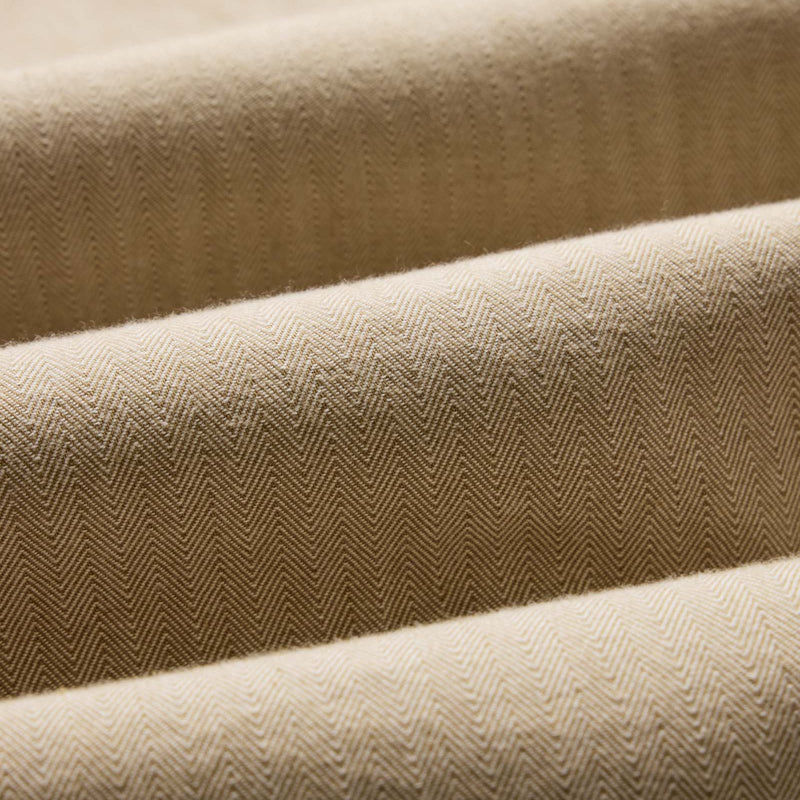 Close-up of beige fabric with a subtle pattern