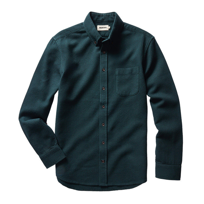 "Long sleeved Forest green collared shirt with brown buttons"