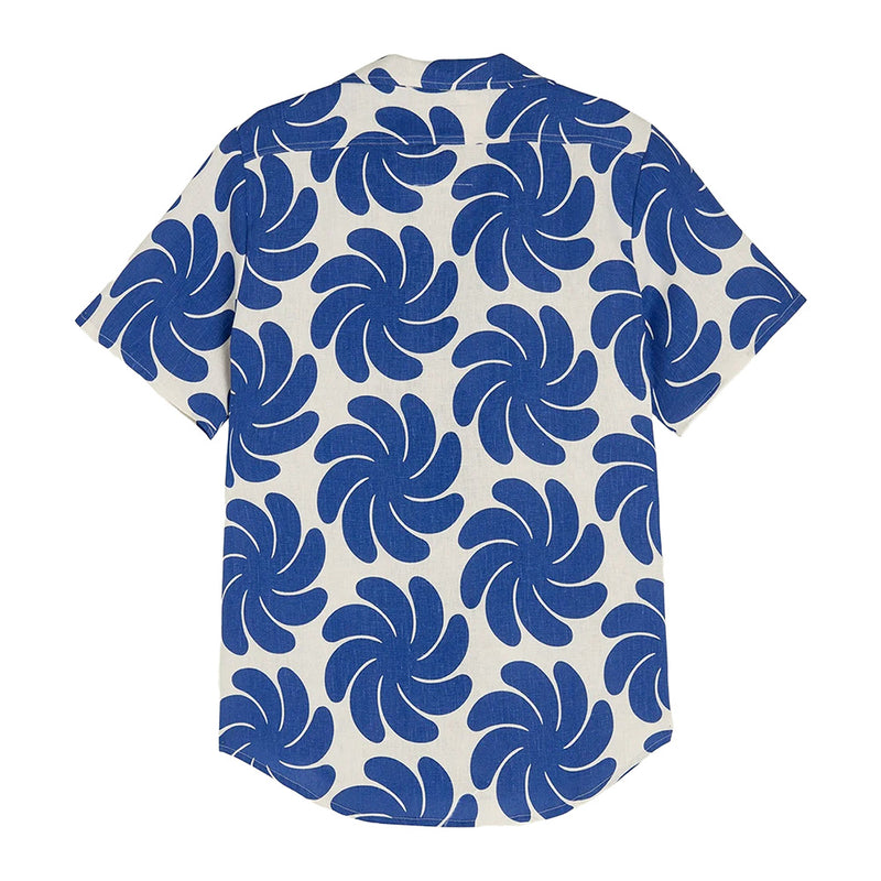" back blue cartoonish flower or palm leaves on a cream button up linen shirt"