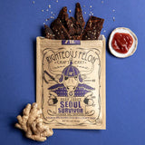 bag of beef jerky brown with purple and black cow jerky spilling out of bag 