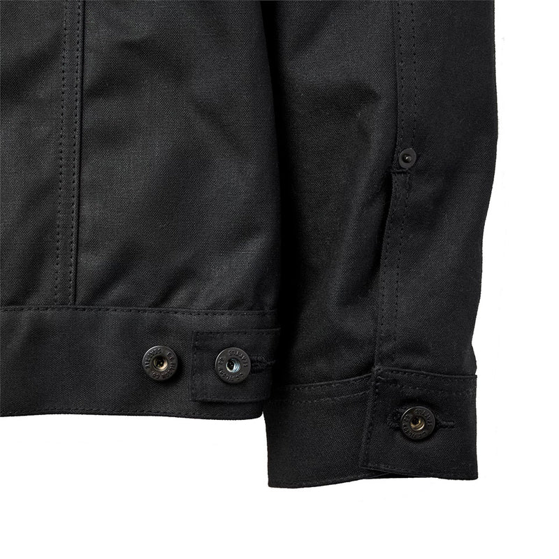 "lined black canvas jacket with button cuffs and adjustable waist strap and buttons"