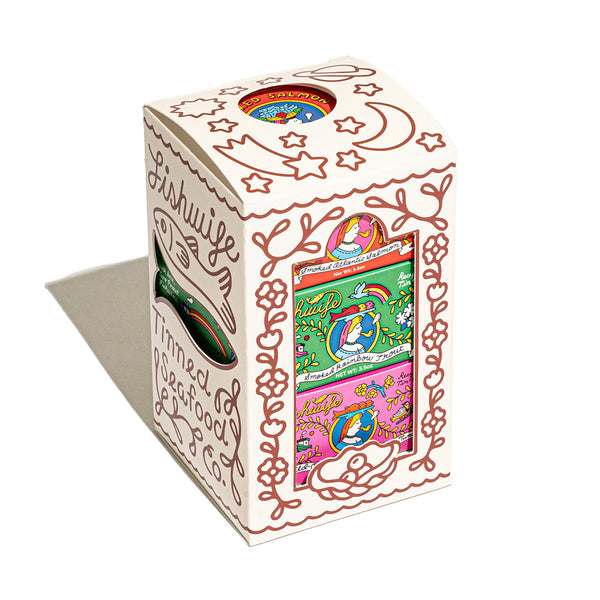 "Colorful cartoon covered box containing a variety pack of three types of smoked fish. salmon and albacore tuna and smoked rainbow trout"