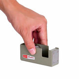 Hand picking up the tape dispenser to show size scale