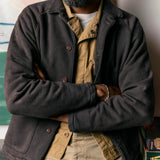 Close up of man wearing cotton terry raglan sleeve shirt with turnback hem sleeves and ribbed collar with arms crossed