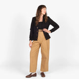 women wearing a black cardigan sweater with a white background