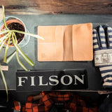 Wallet on Table with Gloves and Plant