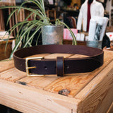 Dark Brown Belt with Brass Hardware on Crate