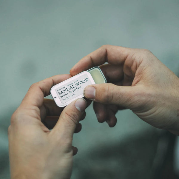 Hands Holding an Open Baume de Parfum