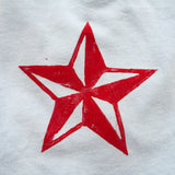 light blue tee with black anchor and red star boy